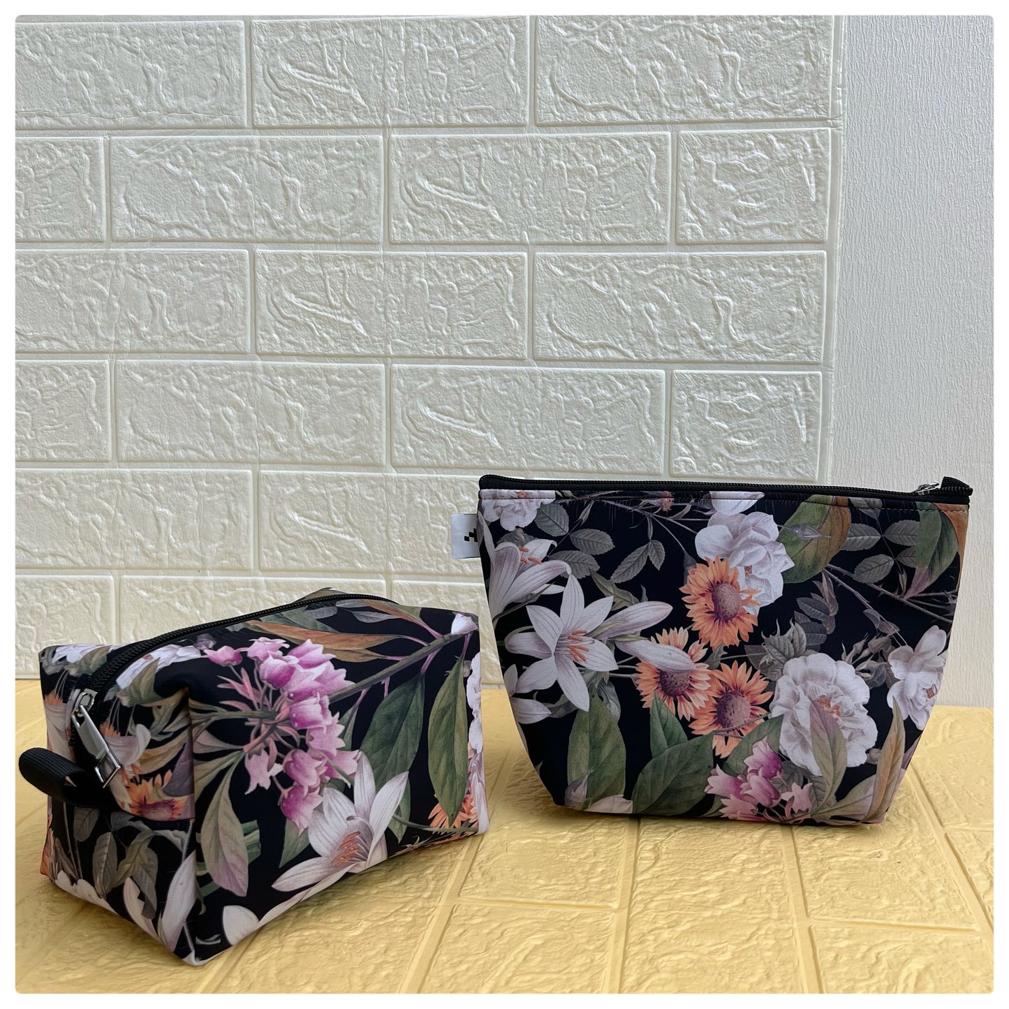 BLACK FLORAL POUCHES