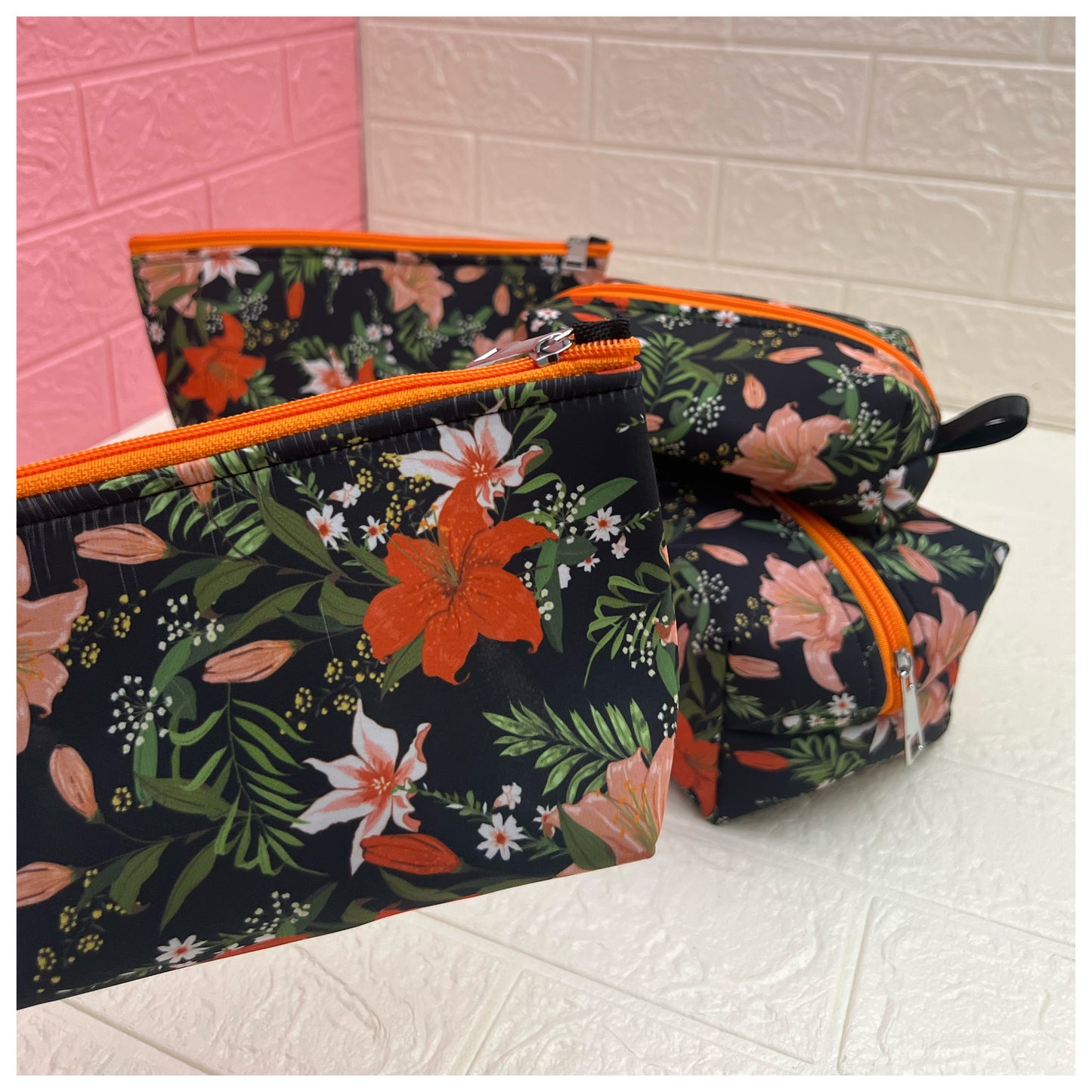 ORANGE BLACK FLORAL POUCHES
