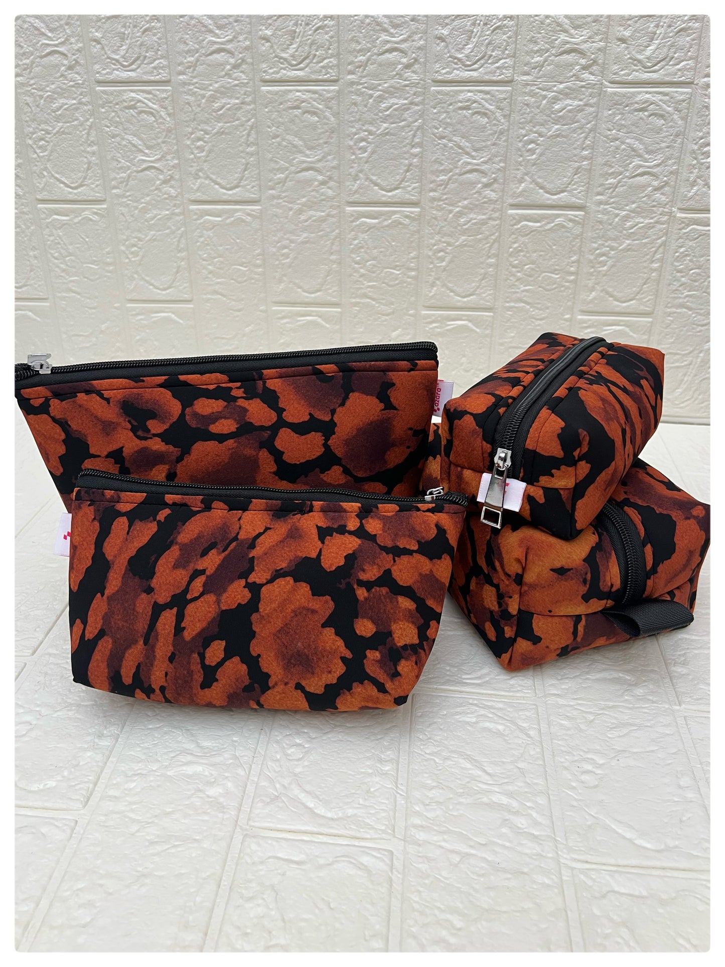 BLACK-ORANGE ABSTRACT POUCHES
