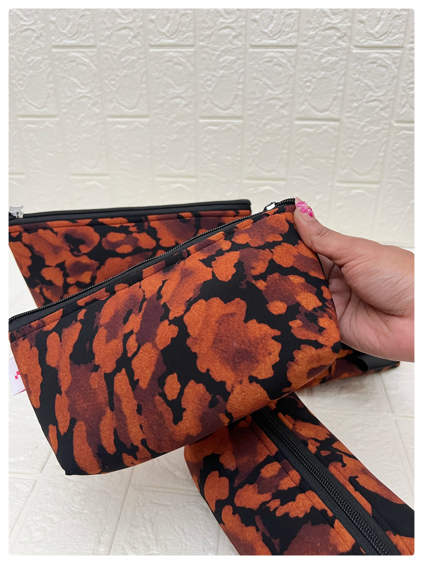 BLACK-ORANGE ABSTRACT POUCHES