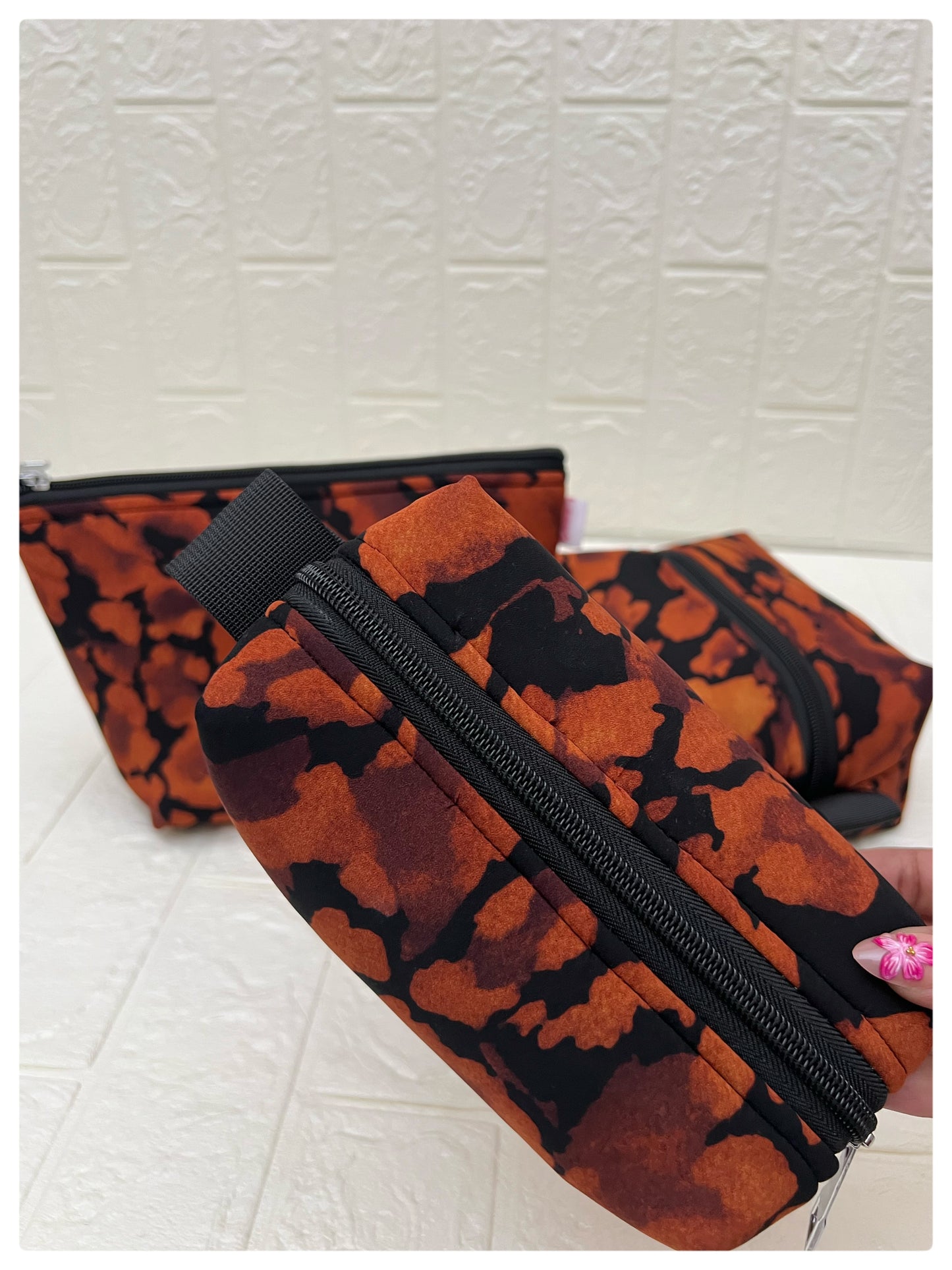 BLACK-ORANGE ABSTRACT POUCHES